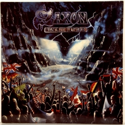 84. SAXON-ROCK THE NATIONS-1986-FIRST PRESS GERMANY-EMI-NMINT/NMINT